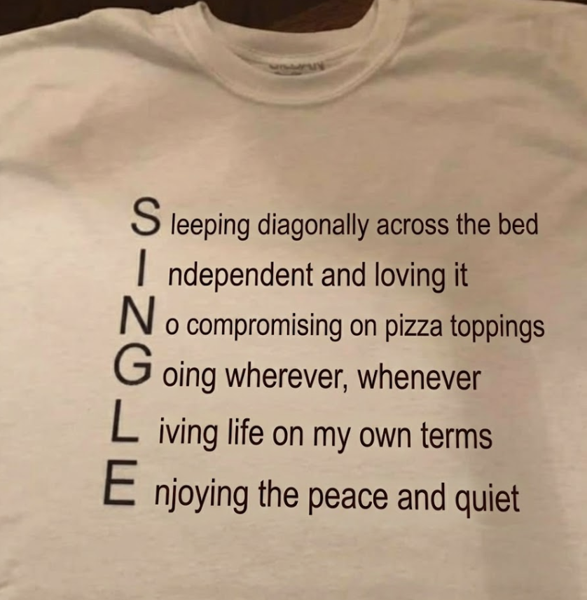 Being single meme showing a shirt with an acronym spelling SINGLE, listing benefits like independence, freedom, and enjoying peace and quiet.